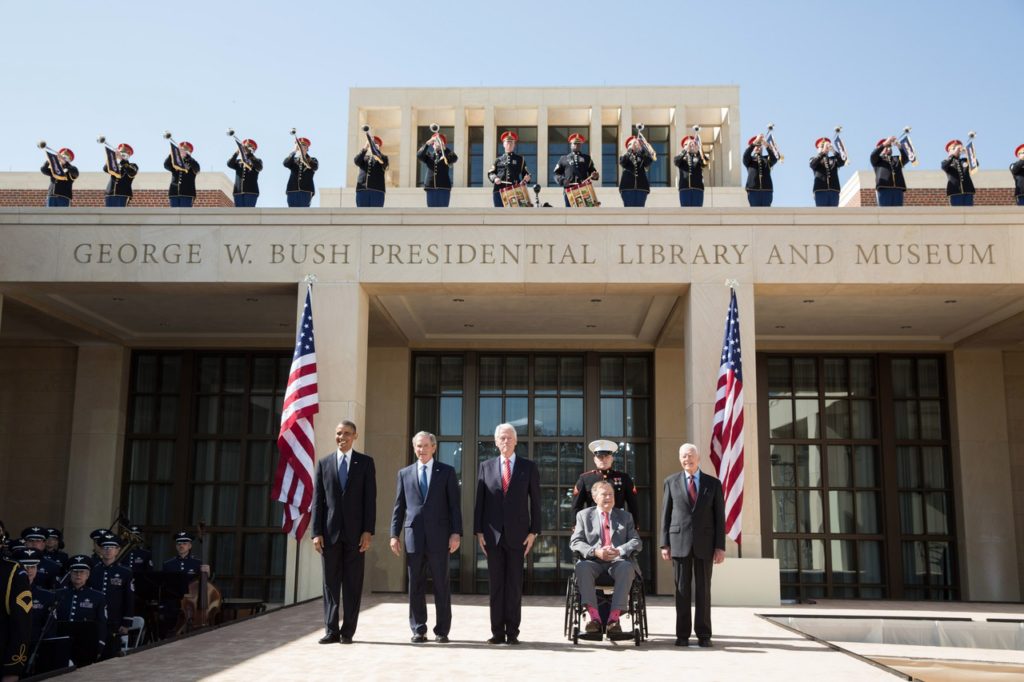 President Barack Obama pauses with former Presidents George W. Bush, Bill Clinton, George H.W. Bush, and Jimmy Carter during the dedication of the George W. Bush Presidential Center at the George W. Bush Presidential Library and Museum on the campus of Southern Methodist University in Dallas, Texas, April 25, 2013. (Official White House Photo by Pete Souza) This official White House photograph is being made available only for publication by news organizations and/or for personal use printing by the subject(s) of the photograph. The photograph may not be manipulated in any way and may not be used in commercial or political materials, advertisements, emails, products, promotions that in any way suggests approval or endorsement of the President, the First Family, or the White House.